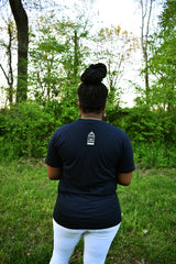 Female model wearing v-neck navy t-shirt with a small, No Egrets Birdcage logo in white on the back between the shoulders.