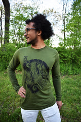 Male model wearing a green, long-sleeved shirt with Cameron McKnight's Dragon design in black on the front.
